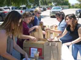 Youth team up to sell 1,000 Swiss sausage meals