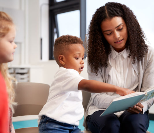 Only 1 in 6 homeless infants and toddlers enrolled in early childhood programs in California, study finds Child reading
