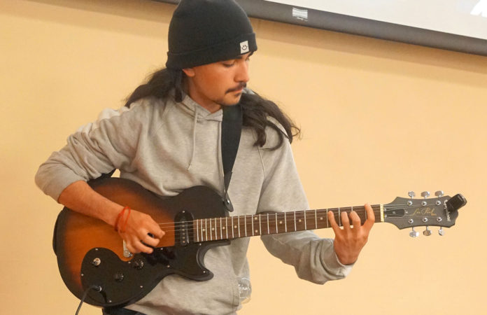 GZ-student-plays-3 Guitars donation