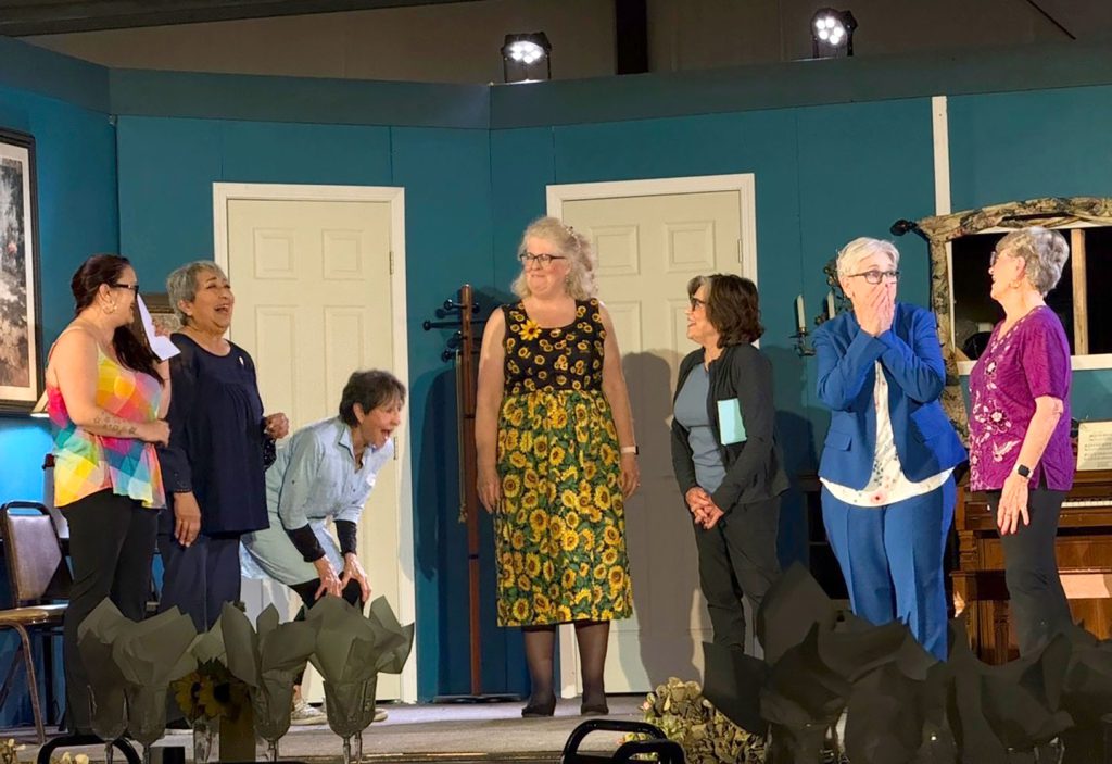 Cast members on stage