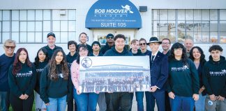 Bob Hoover Academy students with check