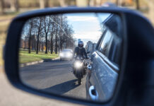 motorcycle and vehicle, view in a side mirror