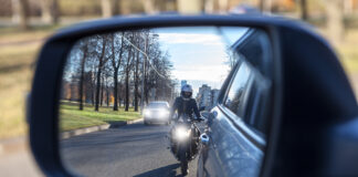 motorcycle and vehicle, view in a side mirror