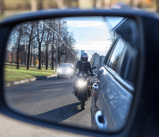motorcycle and vehicle, view in a side mirror