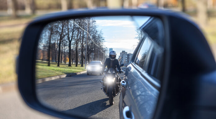 motorcycle and vehicle, view in a side mirror