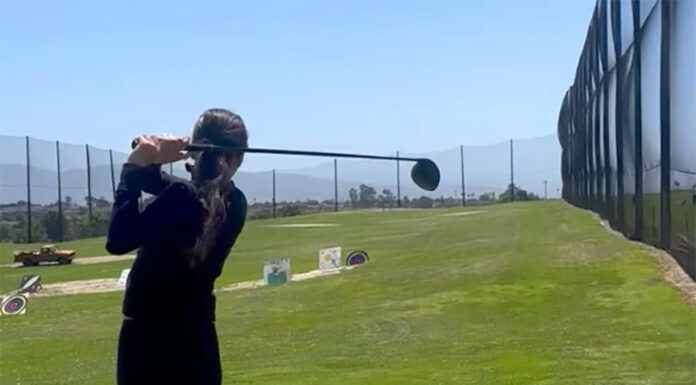 Girl playing golf
