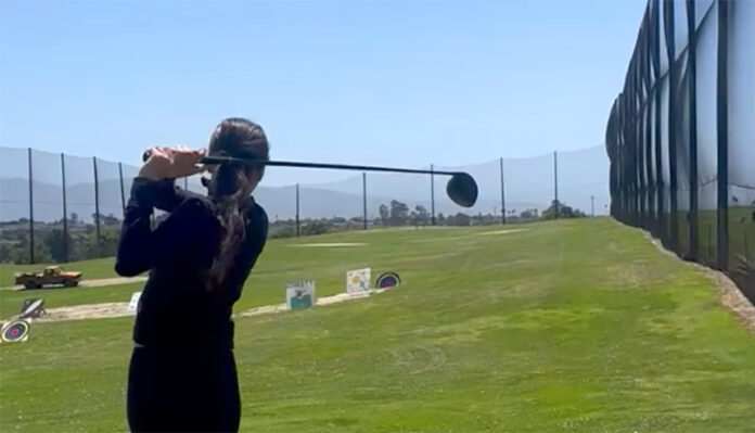 Girl playing golf