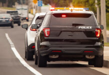 Behind view of a police car that pulled a motorist over to the side of the road