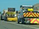 Brush clearing set for Highway 101 near San Ardo Caltrans trucks mounted with Crash Cushions and flashing arrow lights protect highway-side workers