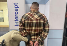 Man under arrest by deputy