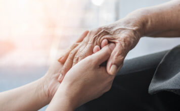 Alzheimer’s Association expands outreach in South Monterey County this fall Parkinson disease patient, Alzheimer elderly senior, Arthritis person hand in support of nursing family caregiver care for disability awareness day