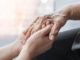 Alzheimer’s Association expands outreach in South Monterey County this fall Parkinson disease patient, Alzheimer elderly senior, Arthritis person hand in support of nursing family caregiver care for disability awareness day