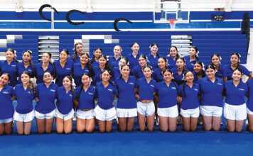 KCHS cheer team with USA staff