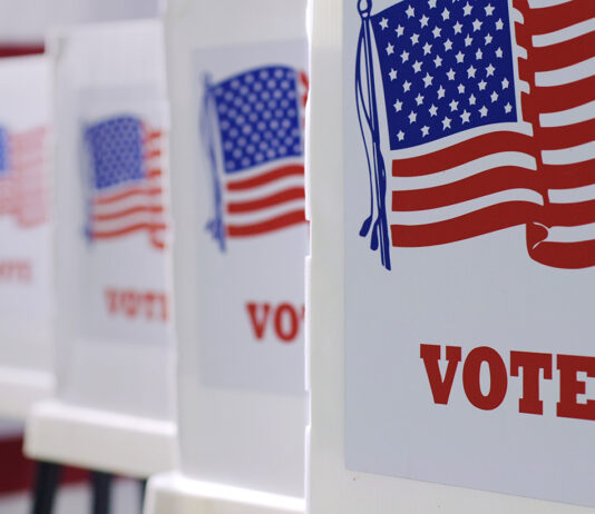 General Election 2026 | King City voters weigh sales tax, school district changes voting booths at polling station during American election